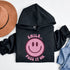 Introducing the ultimate mood booster in fabric form: the "Smile…Pass It On" Happy Face Hoodie! This isn't just any ordinary hoodie; it's a wearable ray of sunshine, guaranteed to spread joy, high-fives, and possibly even spontaneous dance-offs wherever you go.